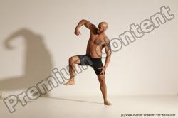 Underwear Gymnastic poses Man Black Muscular Bald Dancing Dynamic poses Academic